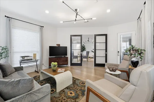 a living room with furniture and a flat screen tv
