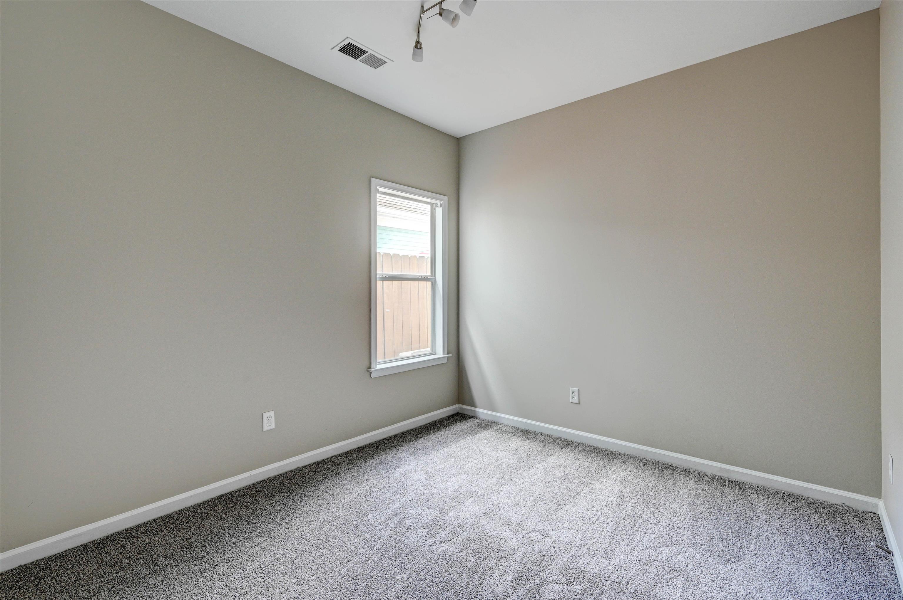 1355 Island Ridge Drive Memphis, TN 38103 - Photo 15 of 21 an empty room with a window