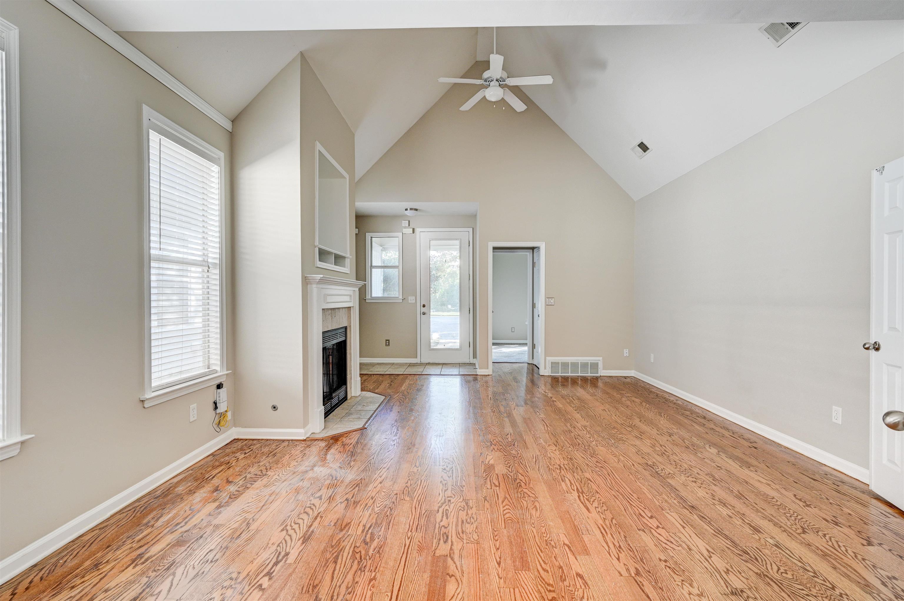 1355 Island Ridge Drive Memphis, TN 38103 - Photo 3 of 21 wooden floor in an empty room with a window