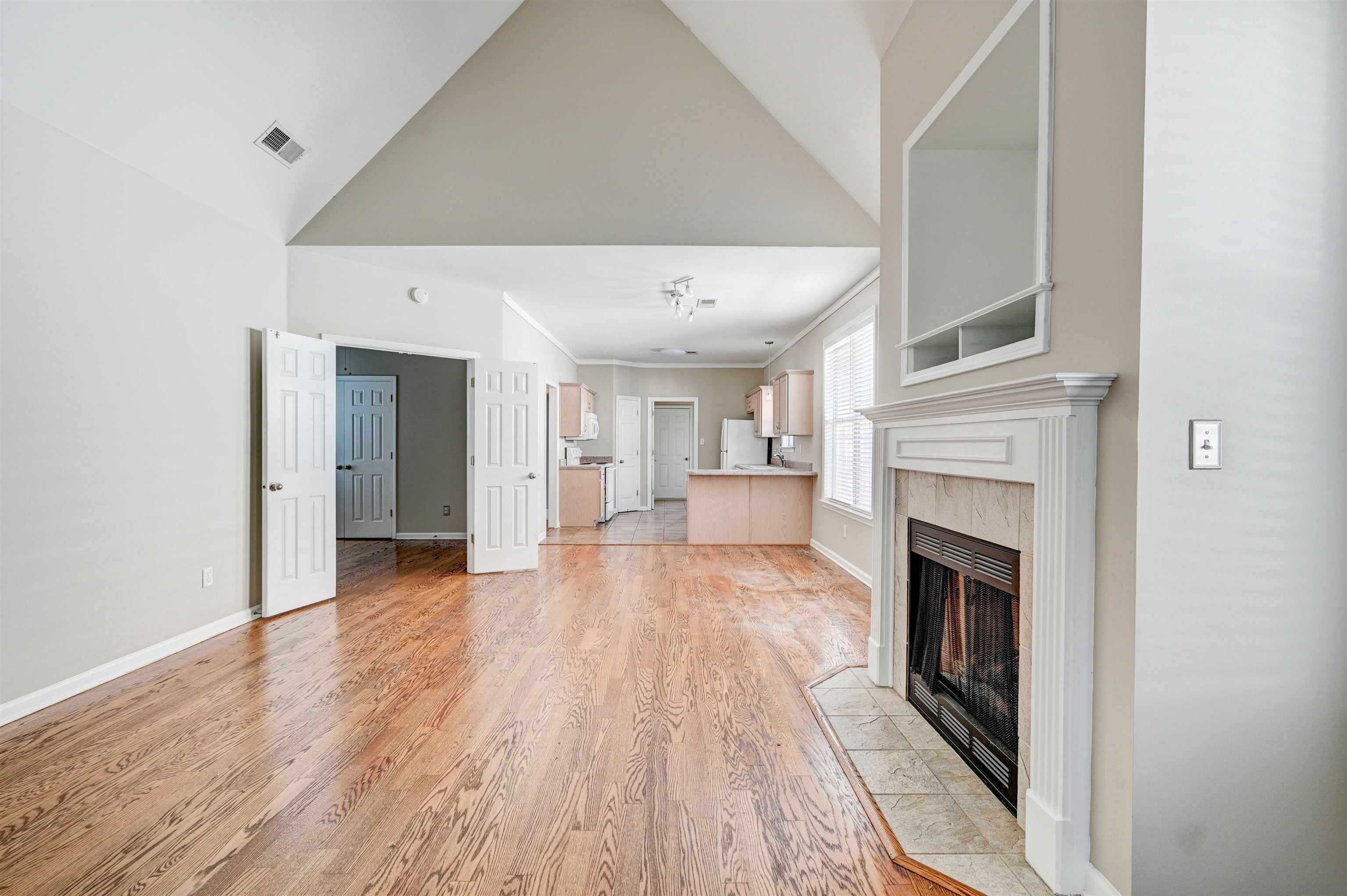 1355 Island Ridge Drive Memphis, TN 38103 - Photo 5 of 21 a view of a livingroom with wooden floor and a fireplace
