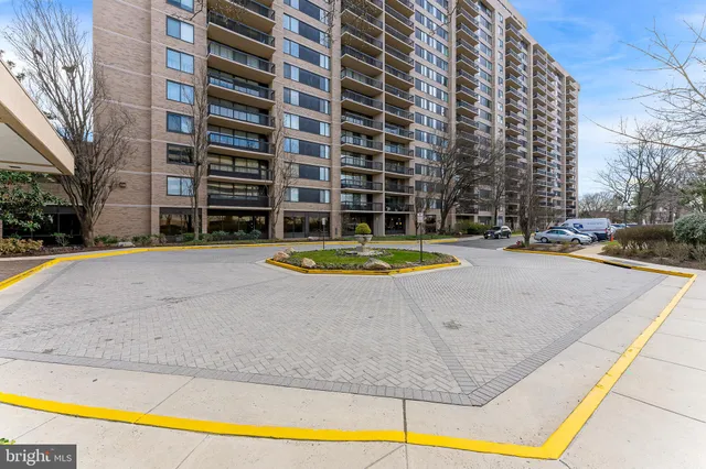 a view of a house with swimming pool and a garden