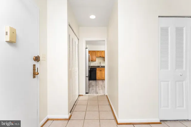 a view of an empty room with windows