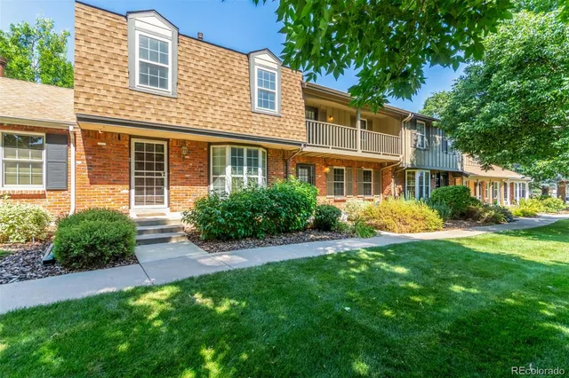 a front view of a house with a yard and porch