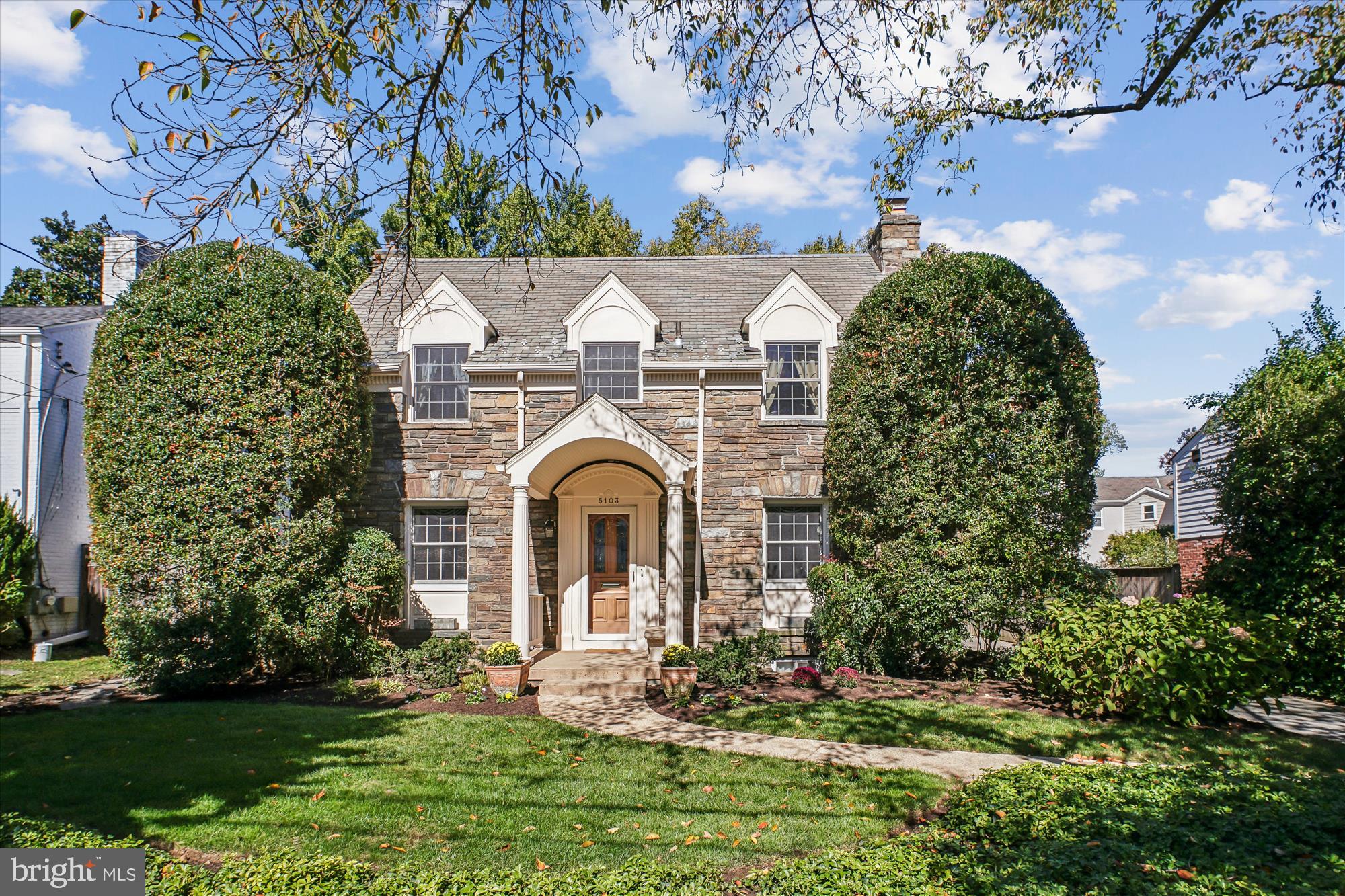5103 Fairglen Lane Chevy Chase, MD 20815 - Photo 1 of 41 a front view of a house with a garden