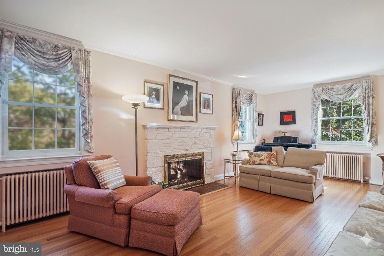 5103 Fairglen Lane Chevy Chase, MD 20815 - Photo 13 of 41 a living room with furniture window and a fireplace