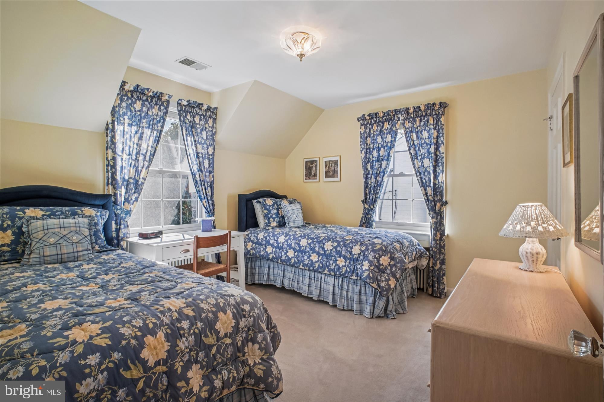 5103 Fairglen Lane Chevy Chase, MD 20815 - Photo 20 of 41 a bedroom with two beds and a window