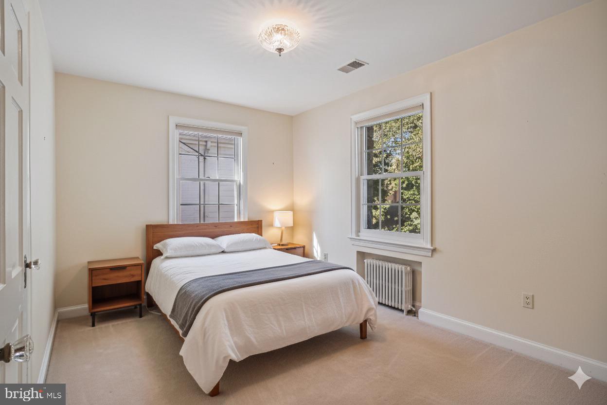 5103 Fairglen Lane Chevy Chase, MD 20815 - Photo 21 of 41 a bedroom with a bed and a window