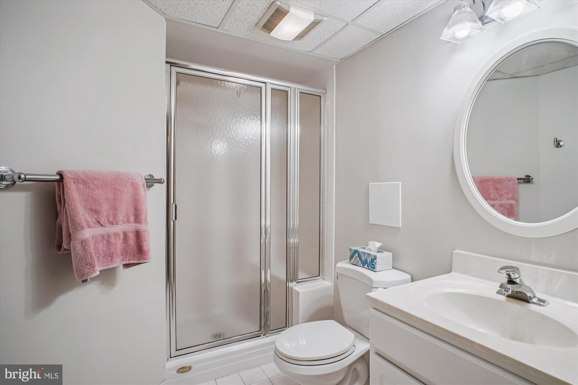 5103 Fairglen Lane Chevy Chase, MD 20815 - Photo 25 of 41 a bathroom with a sink a toilet and shower