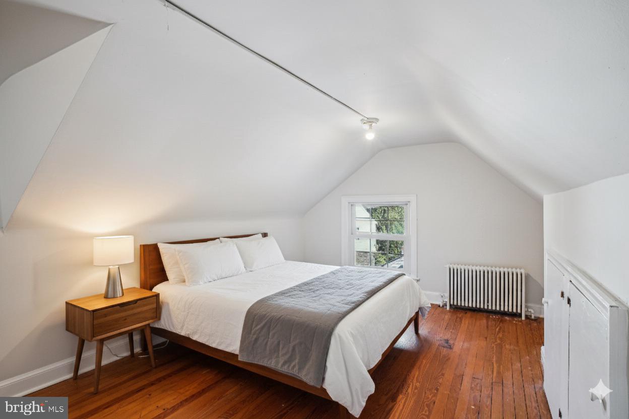 5103 Fairglen Lane Chevy Chase, MD 20815 - Photo 26 of 41 a bedroom with a bed and wooden floor