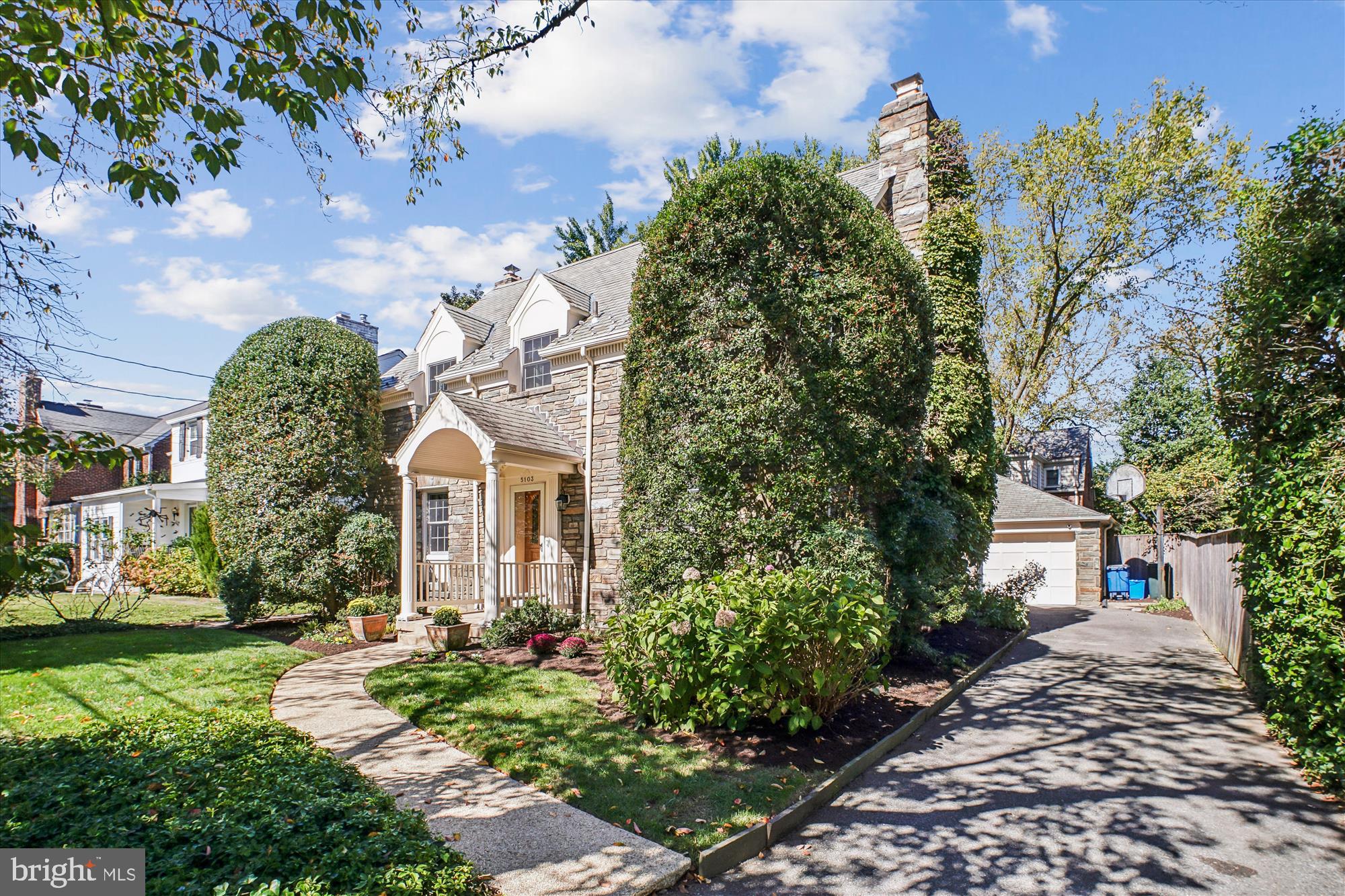 5103 Fairglen Lane Chevy Chase, MD 20815 - Photo 33 of 41 a front view of a house with garden