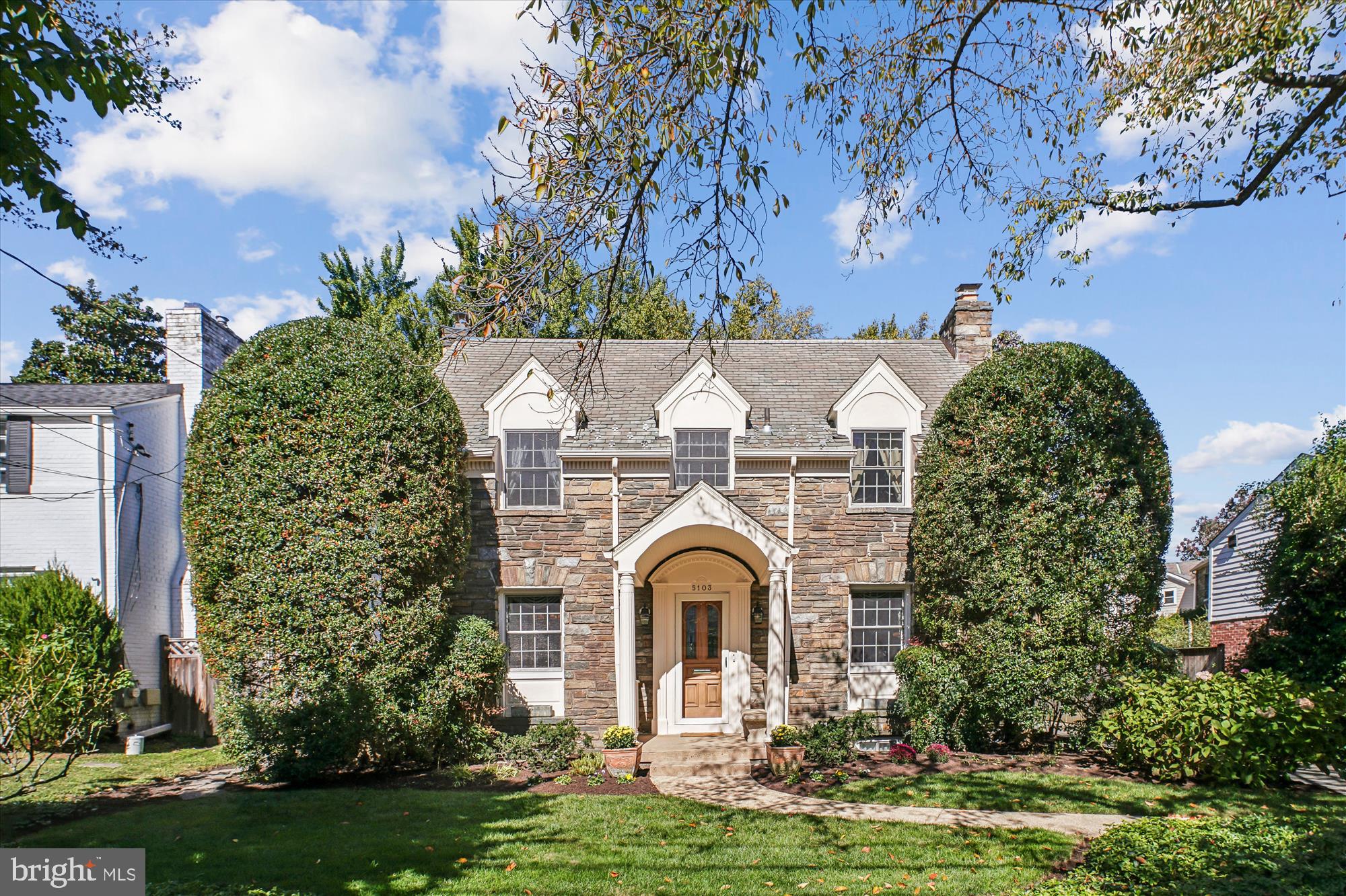 5103 Fairglen Lane Chevy Chase, MD 20815 - Photo 35 of 41 a front view of a house with a garden