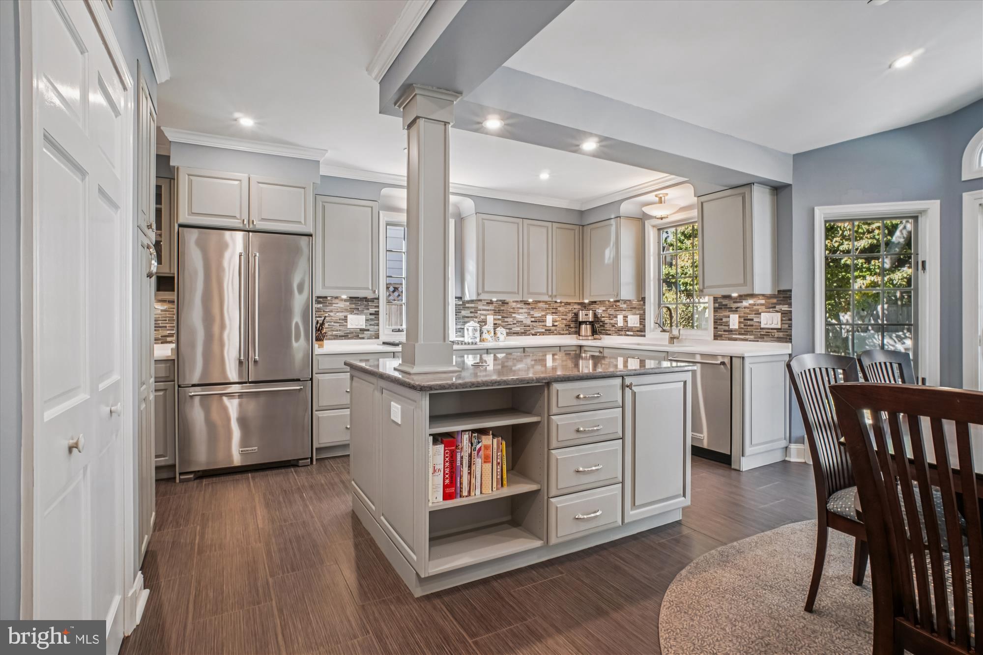 5103 Fairglen Lane Chevy Chase, MD 20815 - Photo 4 of 41 a kitchen with a wooden floor and stainless steel appliances