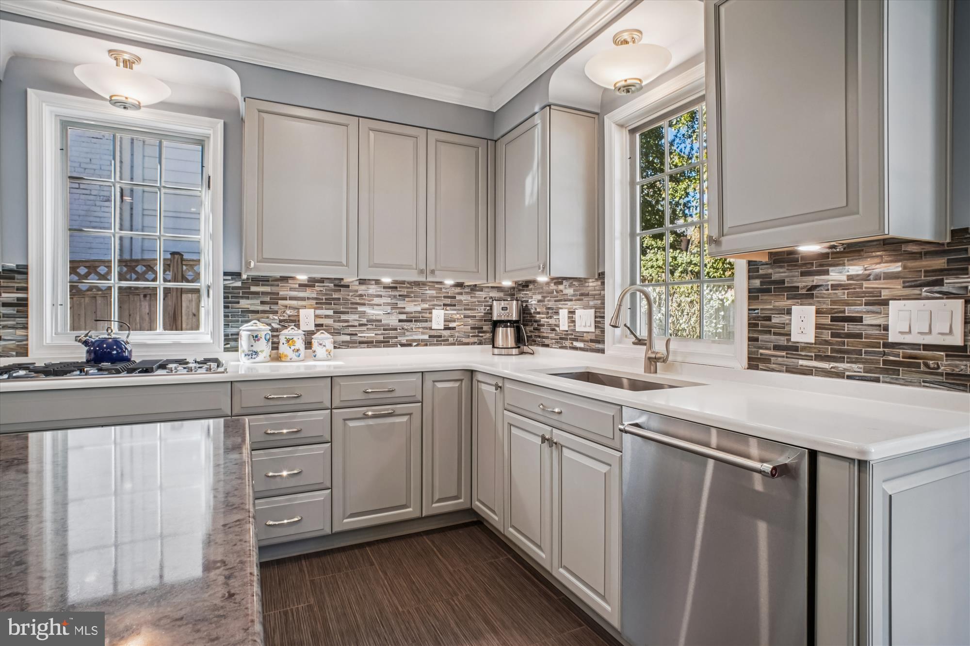 5103 Fairglen Lane Chevy Chase, MD 20815 - Photo 7 of 41 a kitchen with stainless steel appliances granite countertop a sink a stove and cabinets
