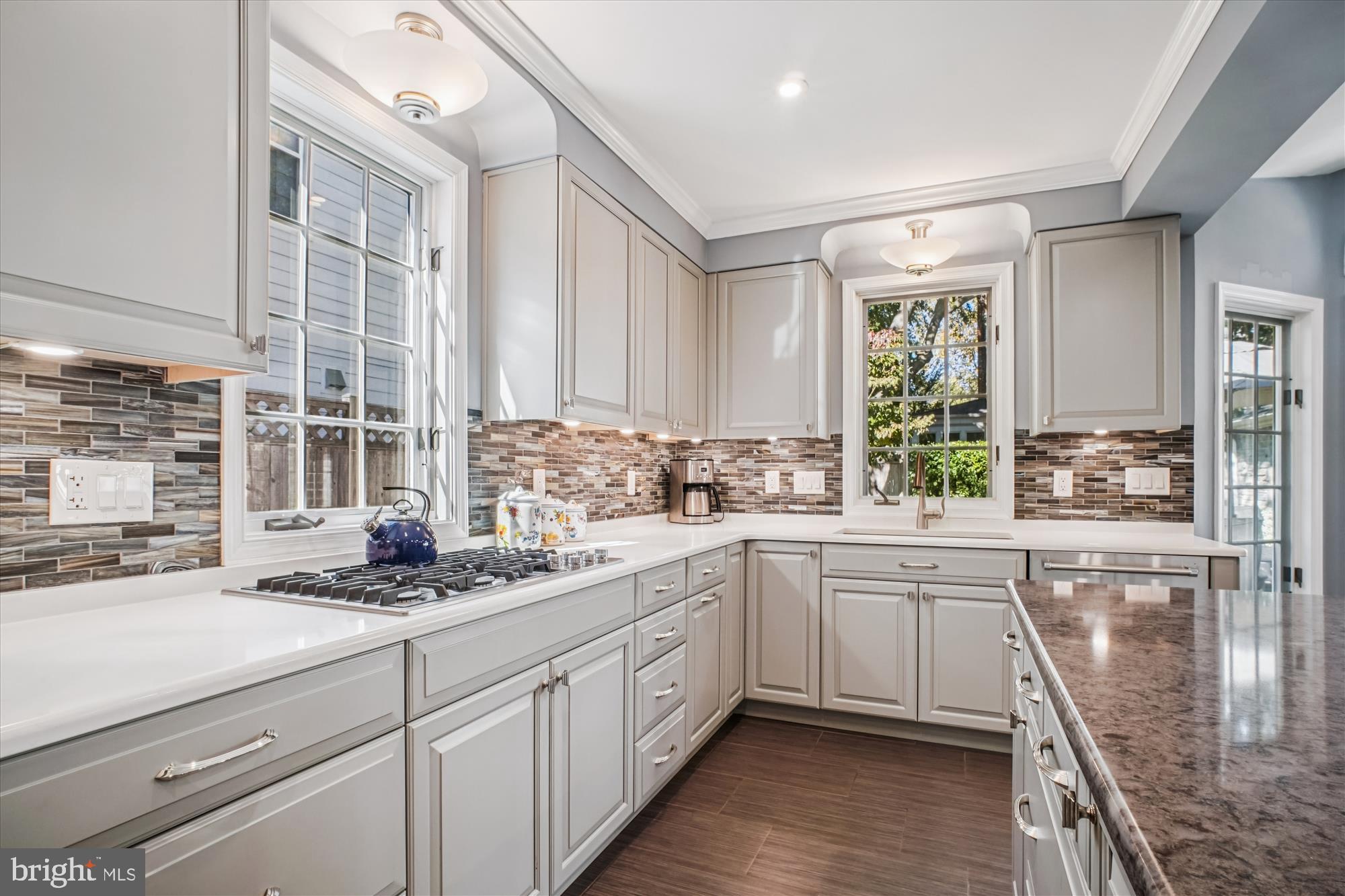 5103 Fairglen Lane Chevy Chase, MD 20815 - Photo 9 of 41 a kitchen with a sink window and cabinets