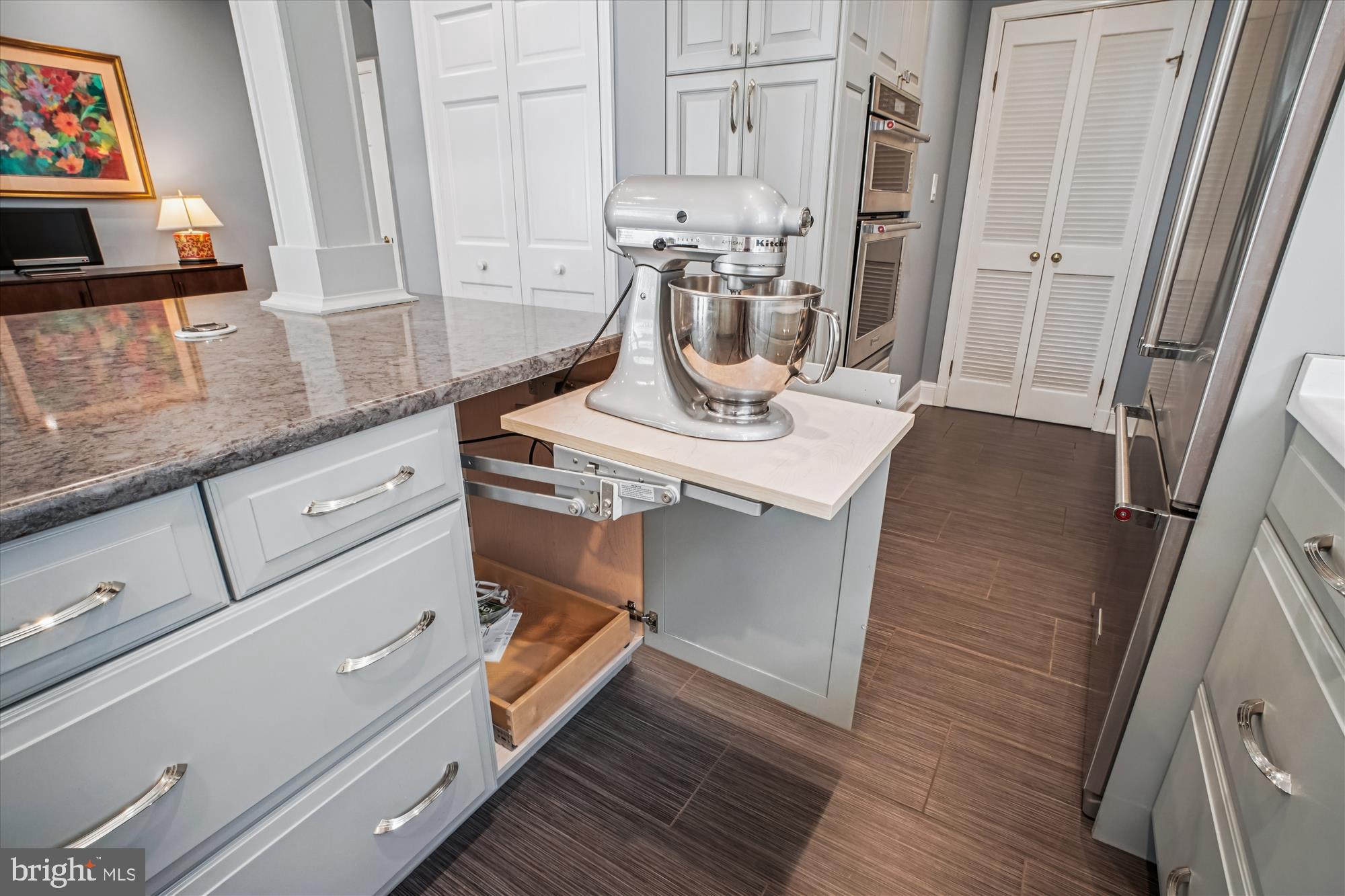 5103 Fairglen Lane Chevy Chase, MD 20815 - Photo 10 of 41 a kitchen with appliances cabinets and wooden floor