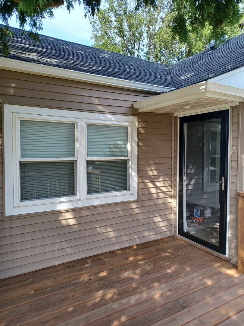 9135 South 53rd Avenue Oak Lawn, IL 60453 - Photo 1 of 9 a view of a brick house with a large window