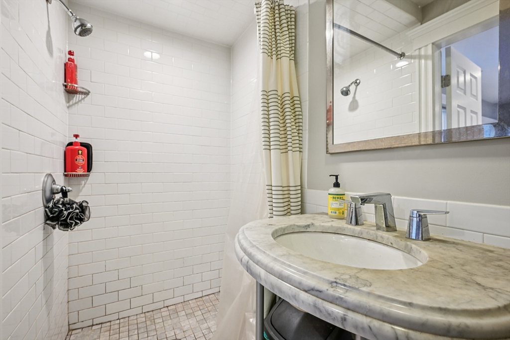 600 Shirley Street, Unit 4 Winthrop, MA 02152 - Photo 21 of 29 a bathroom with a sink and a mirror