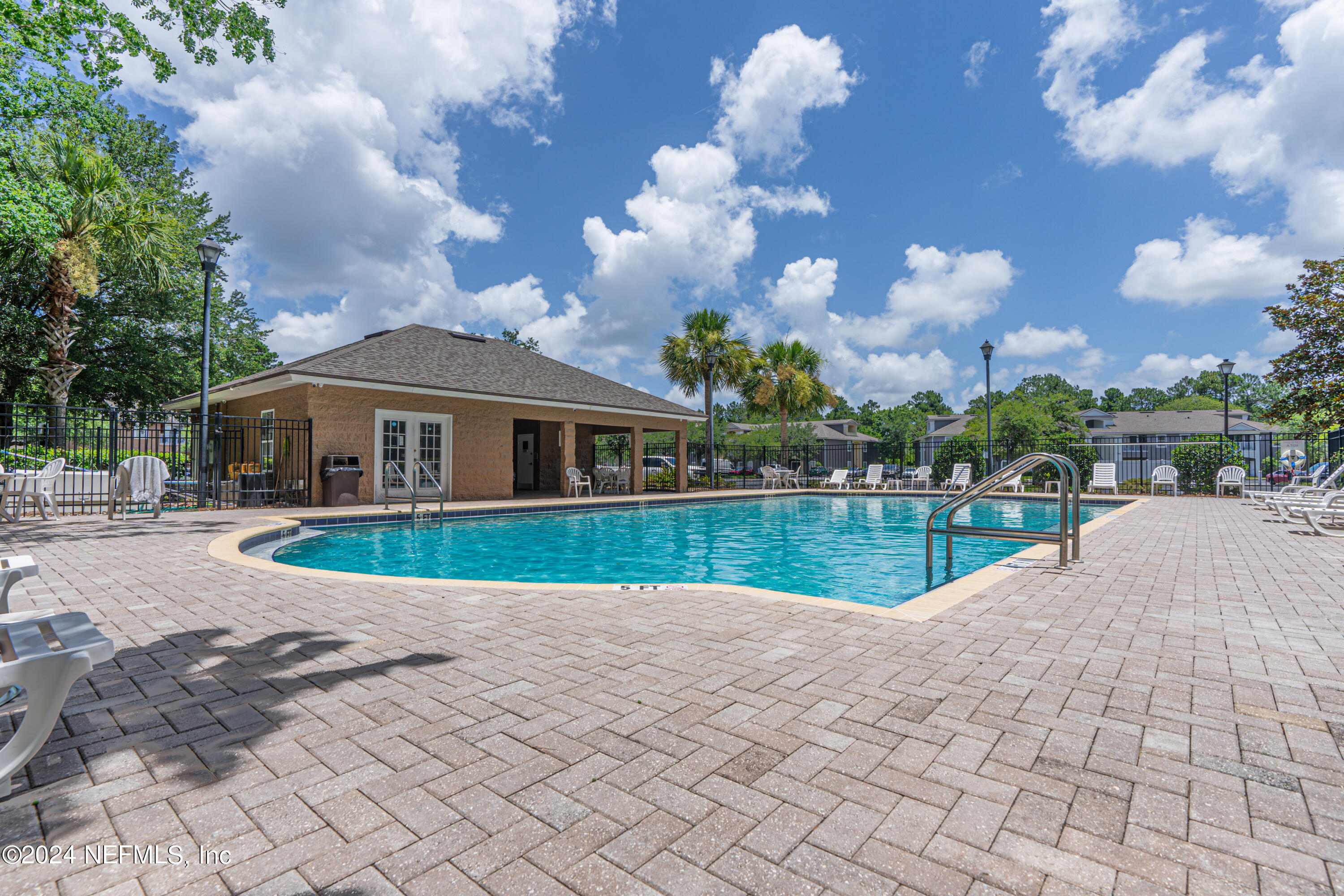 7920 Merrill Road, Unit 709 Jacksonville, FL 32277 - Photo 19 of 25 a view of house with garden and entertaining space
