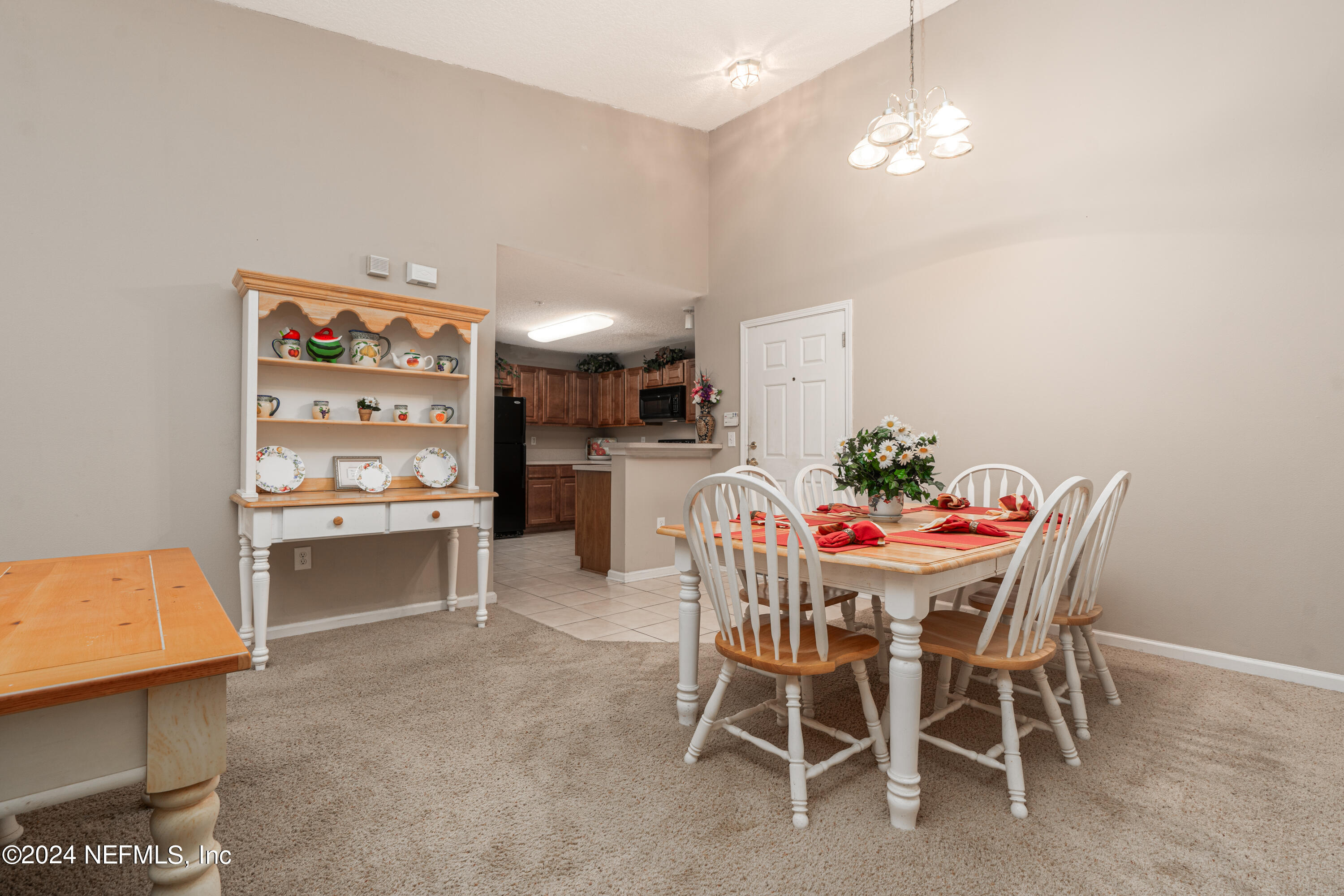 7920 Merrill Road, Unit 709 Jacksonville, FL 32277 - Photo 5 of 25 a dining room with furniture and window