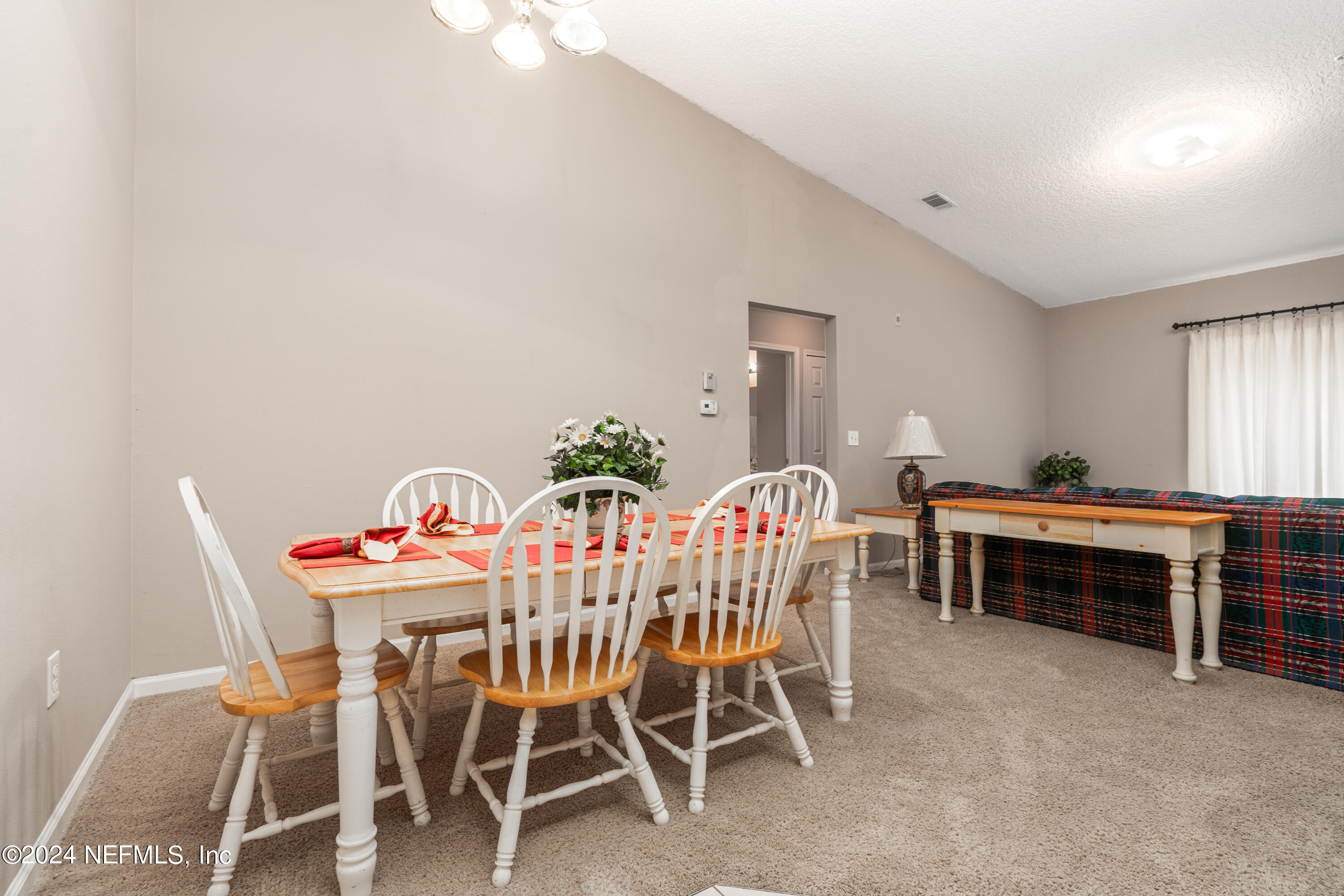 7920 Merrill Road, Unit 709 Jacksonville, FL 32277 - Photo 6 of 25 a dining room with furniture and window