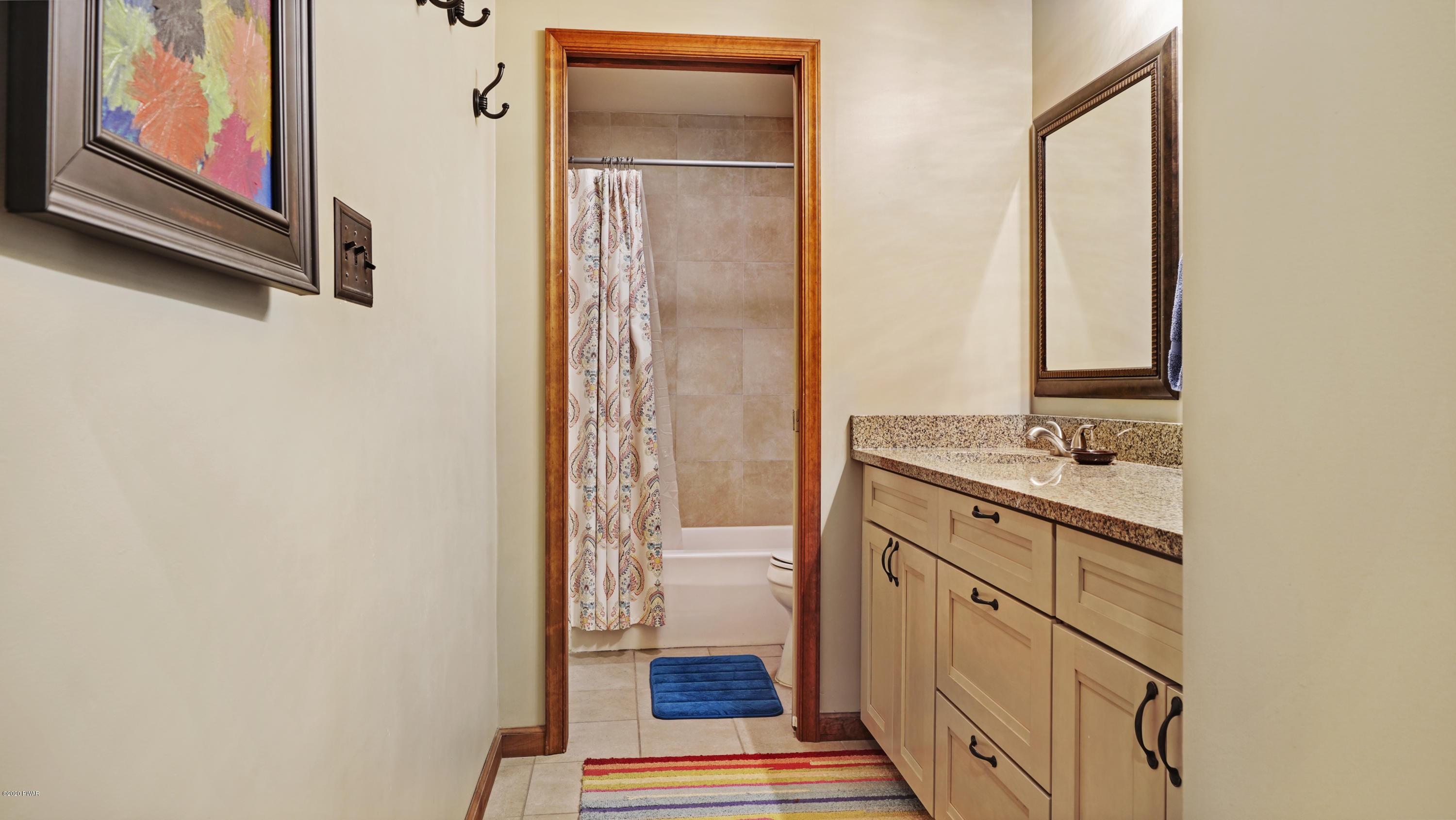 161 J J Road Moscow, PA 18444 - Photo 54 of 73 a bathroom with a granite countertop sink and a mirror