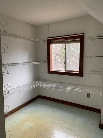 a view of lot of window and bedroom