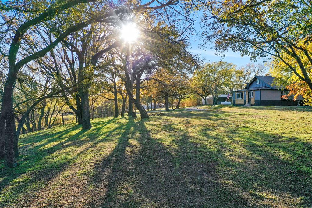 308 Country Club Road Argyle, TX 76226 - Photo 2 of 37 a view of a yard with a tree