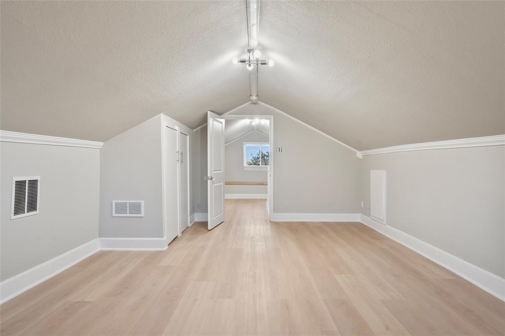308 Country Club Road Argyle, TX 76226 - Photo 29 of 37 a view of a room with wooden floor ceiling fan and windows