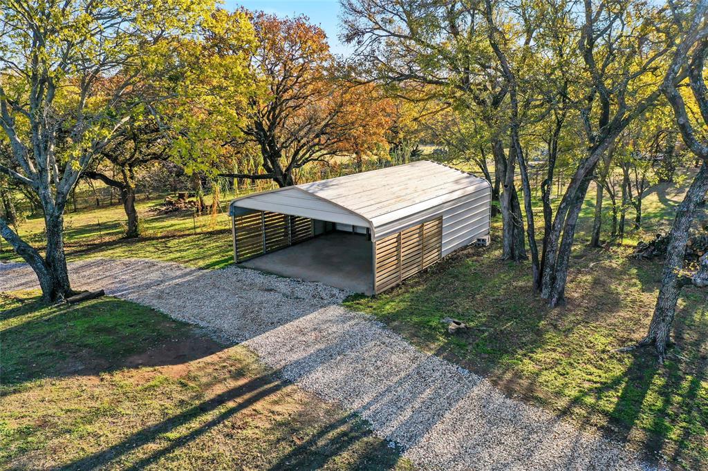 308 Country Club Road Argyle, TX 76226 - Photo 32 of 37 a view of a house with a yard and sitting area