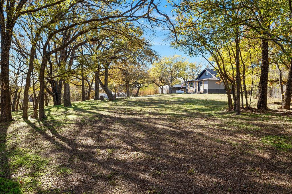 308 Country Club Road Argyle, TX 76226 - Photo 33 of 37 a view of road with trees