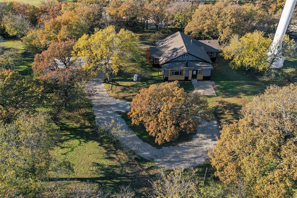 308 Country Club Road Argyle, TX 76226 - Photo 36 of 37 a front view of house with a garden