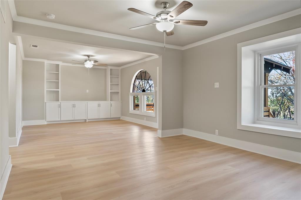 308 Country Club Road Argyle, TX 76226 - Photo 8 of 37 a view of an empty room with window and wooden floor