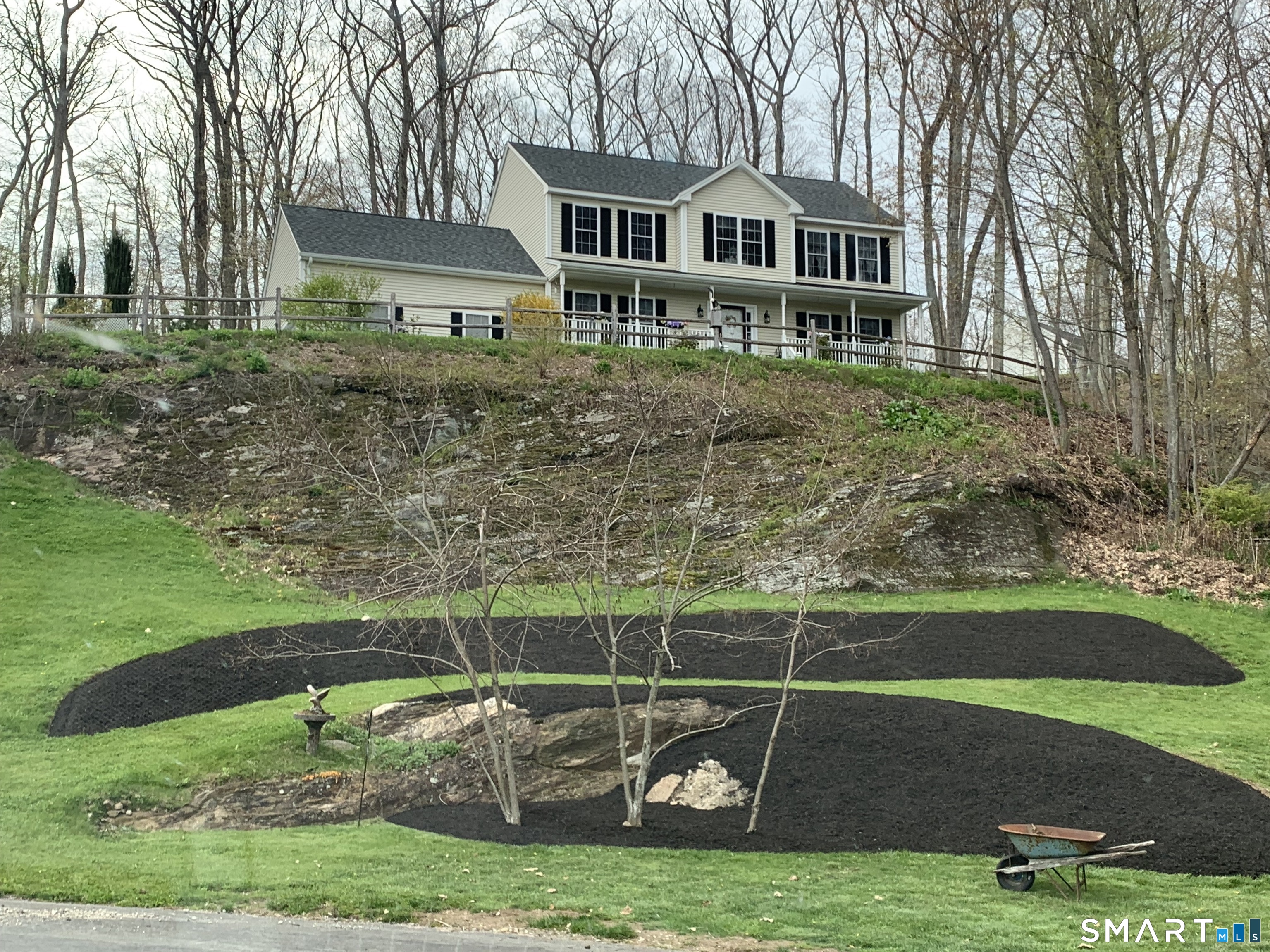 a front view of a house with garden