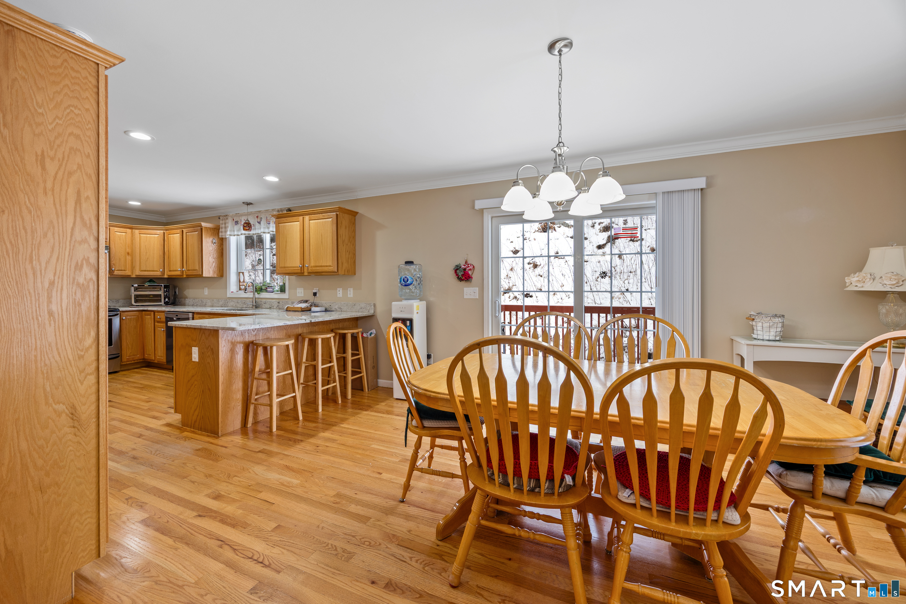 3 Ellen Lane Thomaston, CT 06787 - Photo 11 of 40 a view of a dining room with furniture window and wooden floor