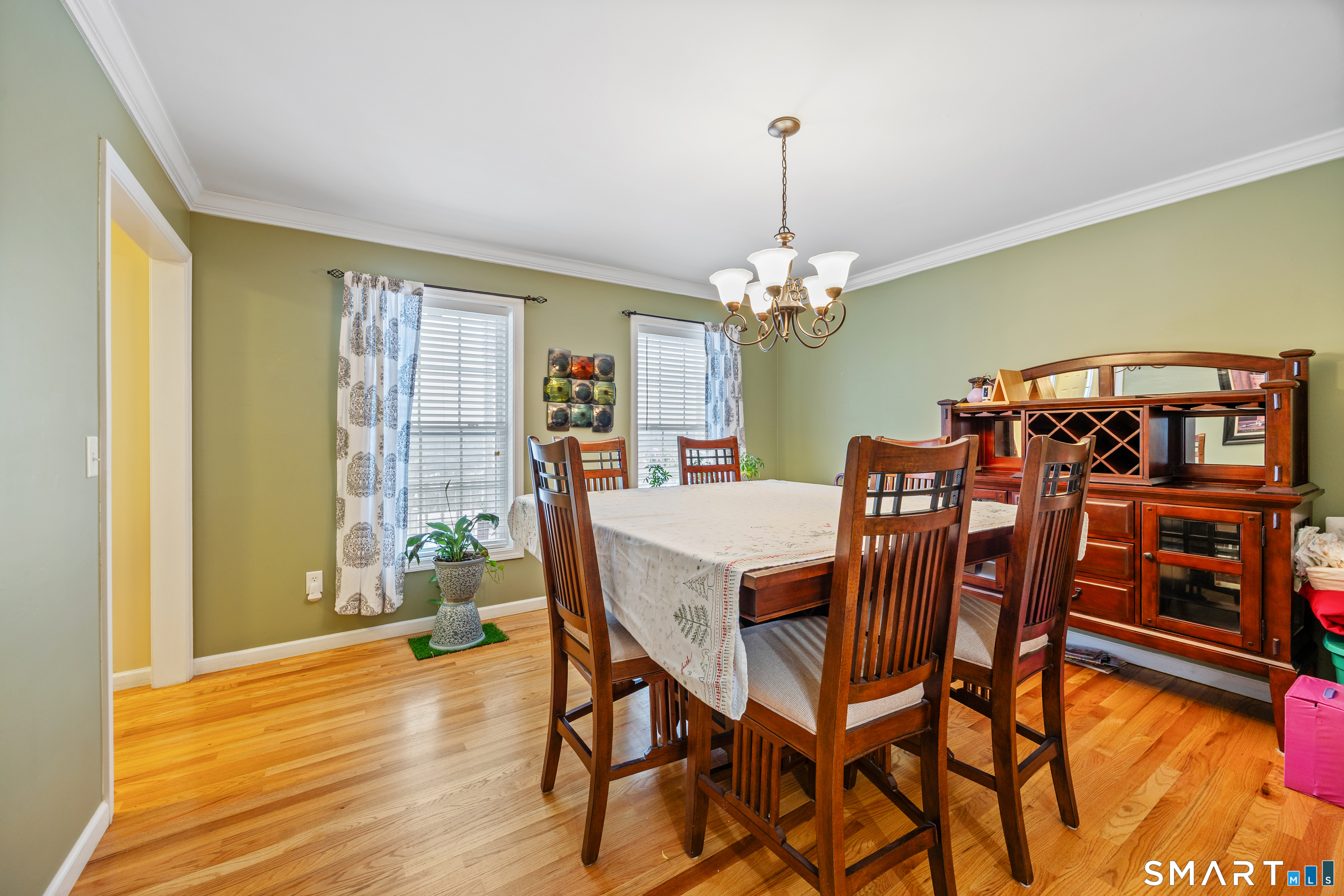 3 Ellen Lane Thomaston, CT 06787 - Photo 15 of 40 a view of a dining room with furniture and chandelier