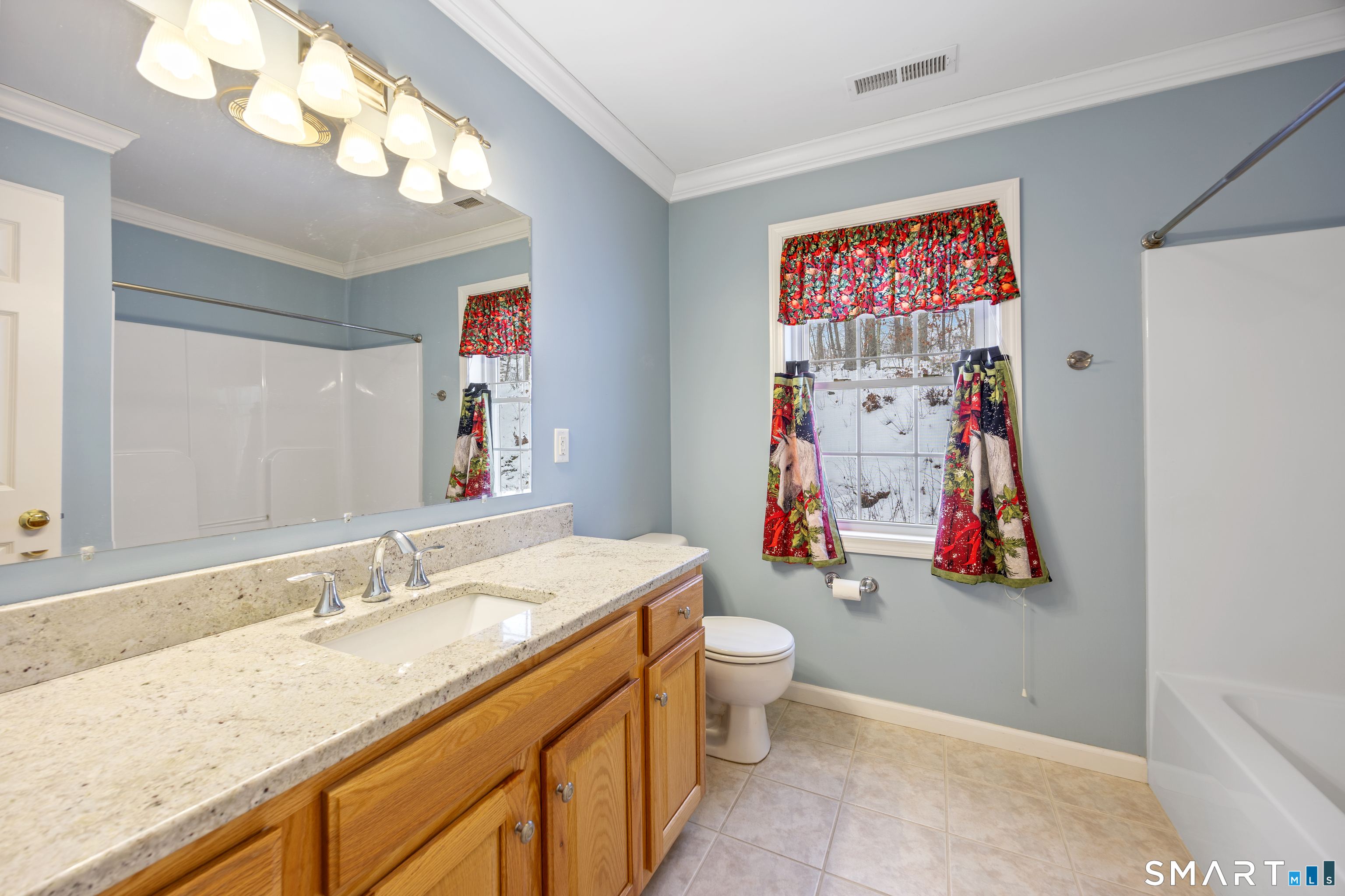 3 Ellen Lane Thomaston, CT 06787 - Photo 21 of 40 a bathroom with a granite countertop sink and a mirror