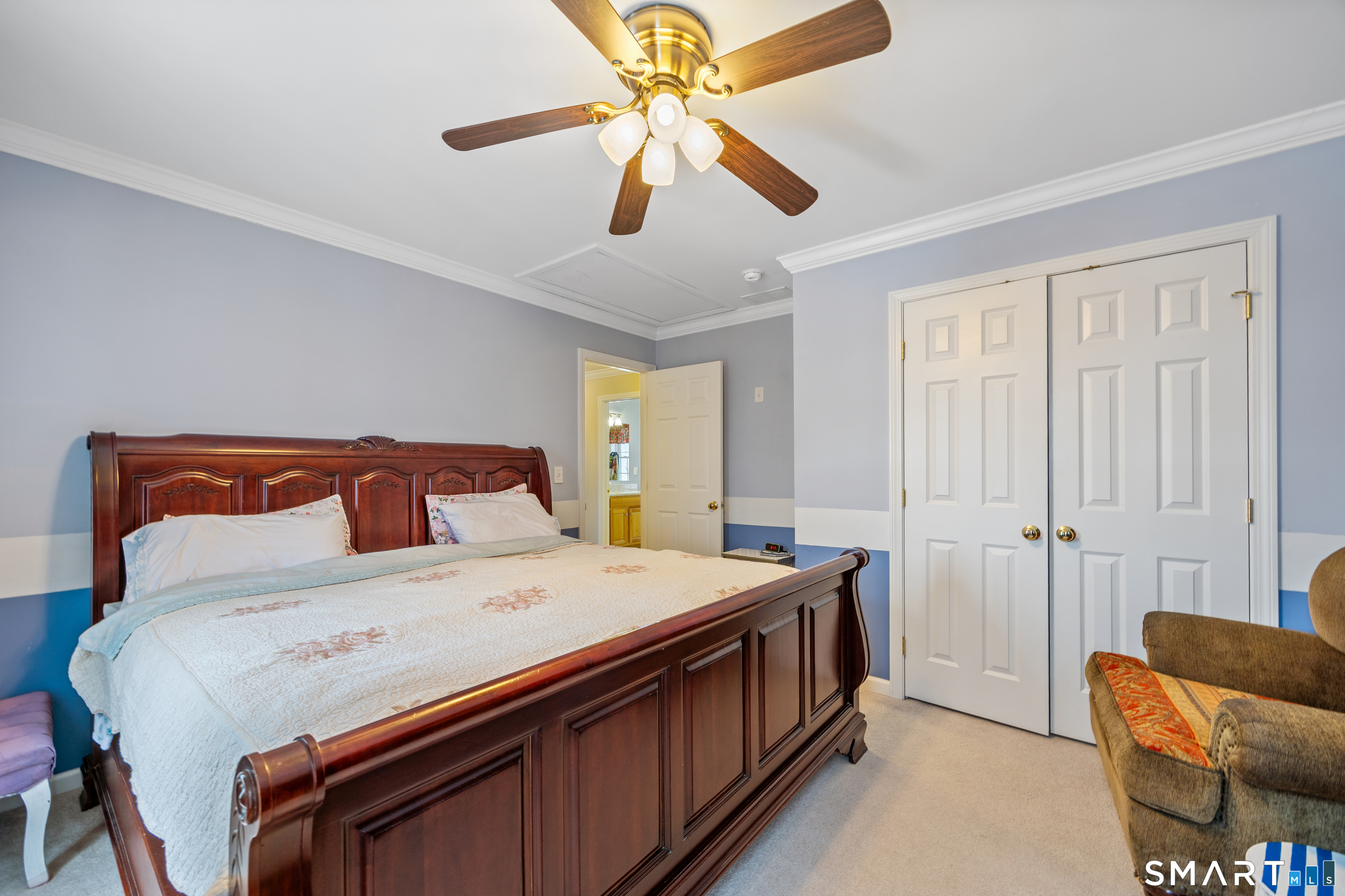 3 Ellen Lane Thomaston, CT 06787 - Photo 22 of 40 a bedroom with a bed and a chandelier