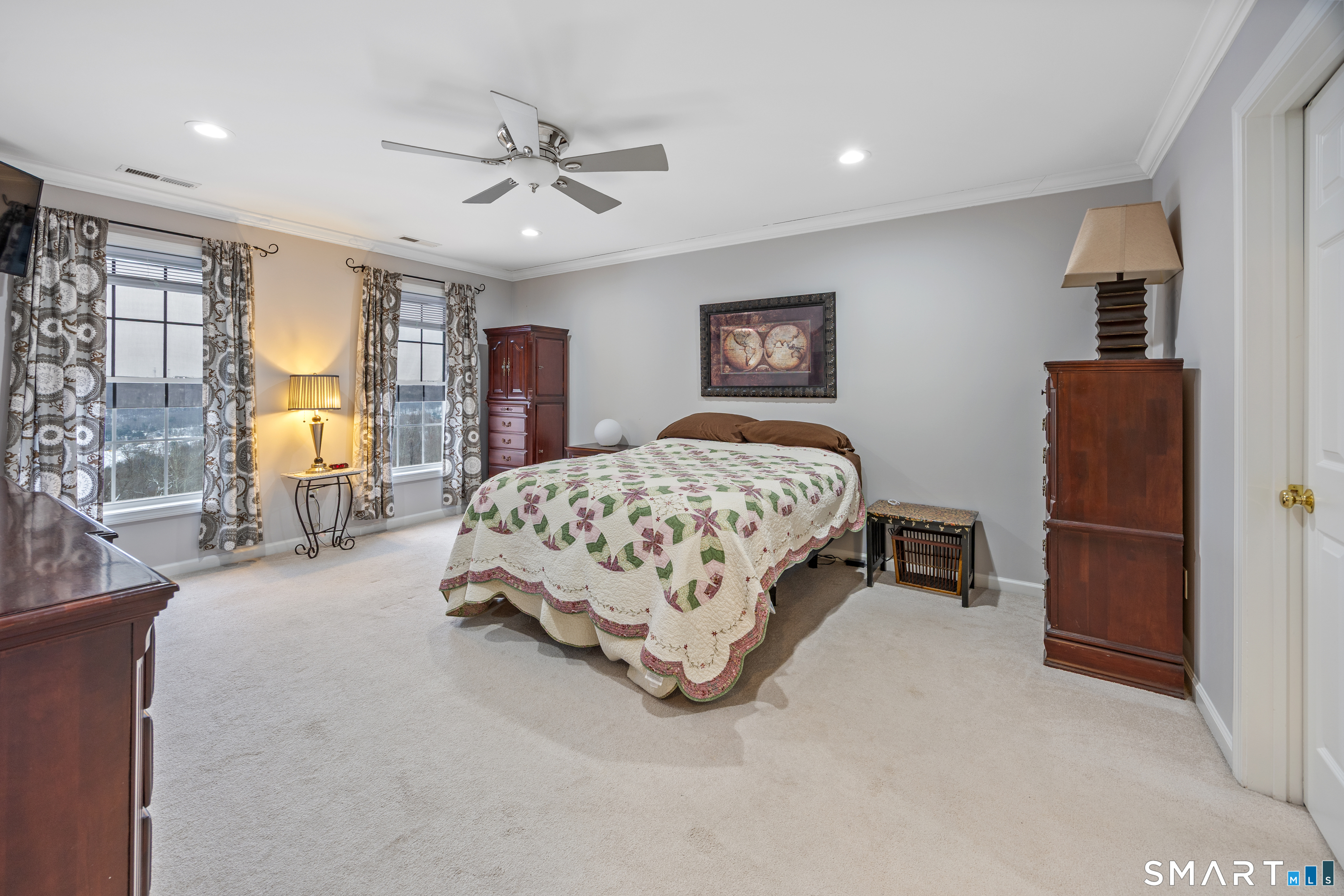 3 Ellen Lane Thomaston, CT 06787 - Photo 24 of 40 a bedroom with a bed and a chandelier