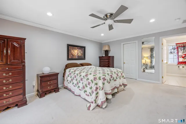 a bed room with a bed and a chandelier