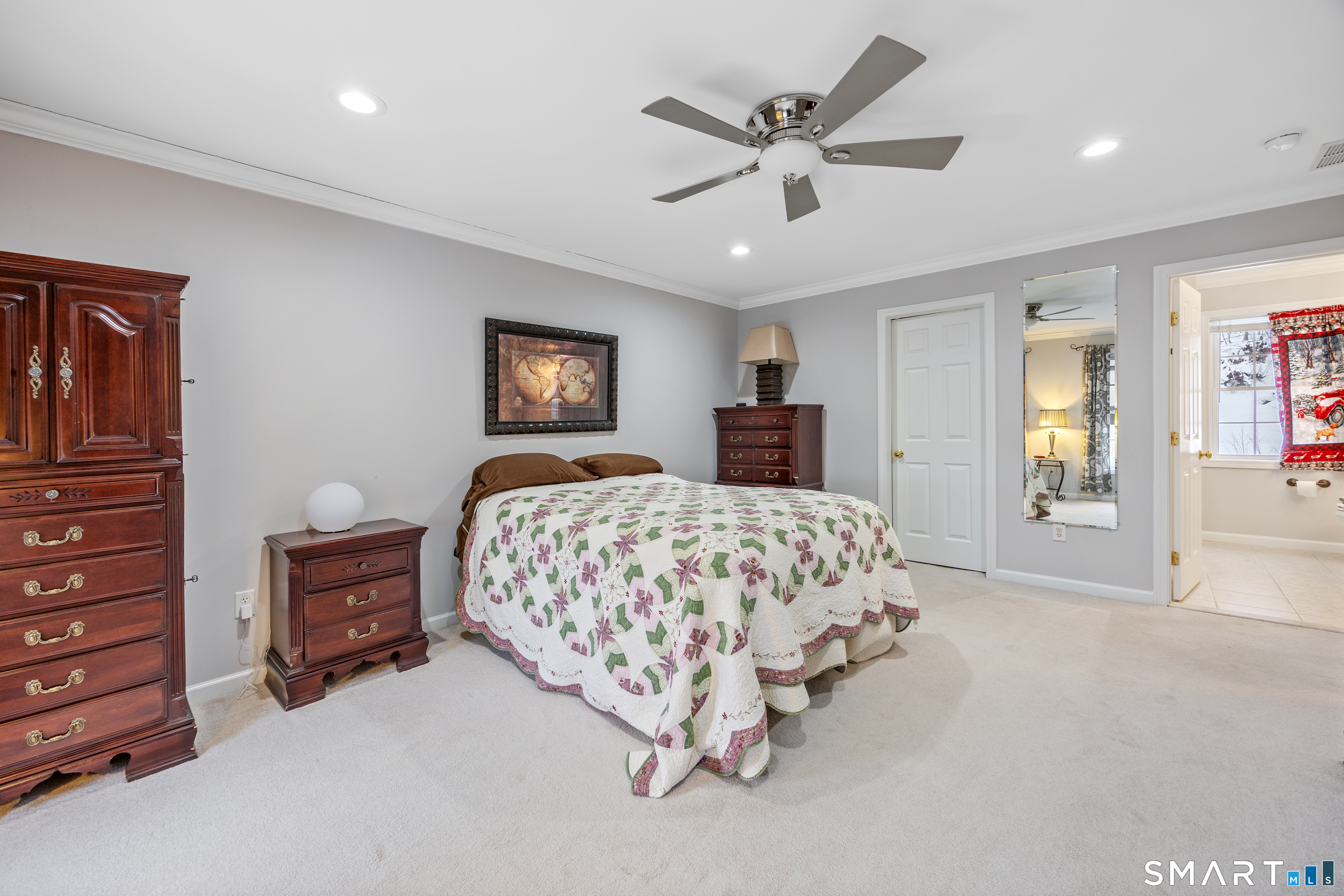 3 Ellen Lane Thomaston, CT 06787 - Photo 25 of 40 a spacious bedroom with a bed and a chandelier