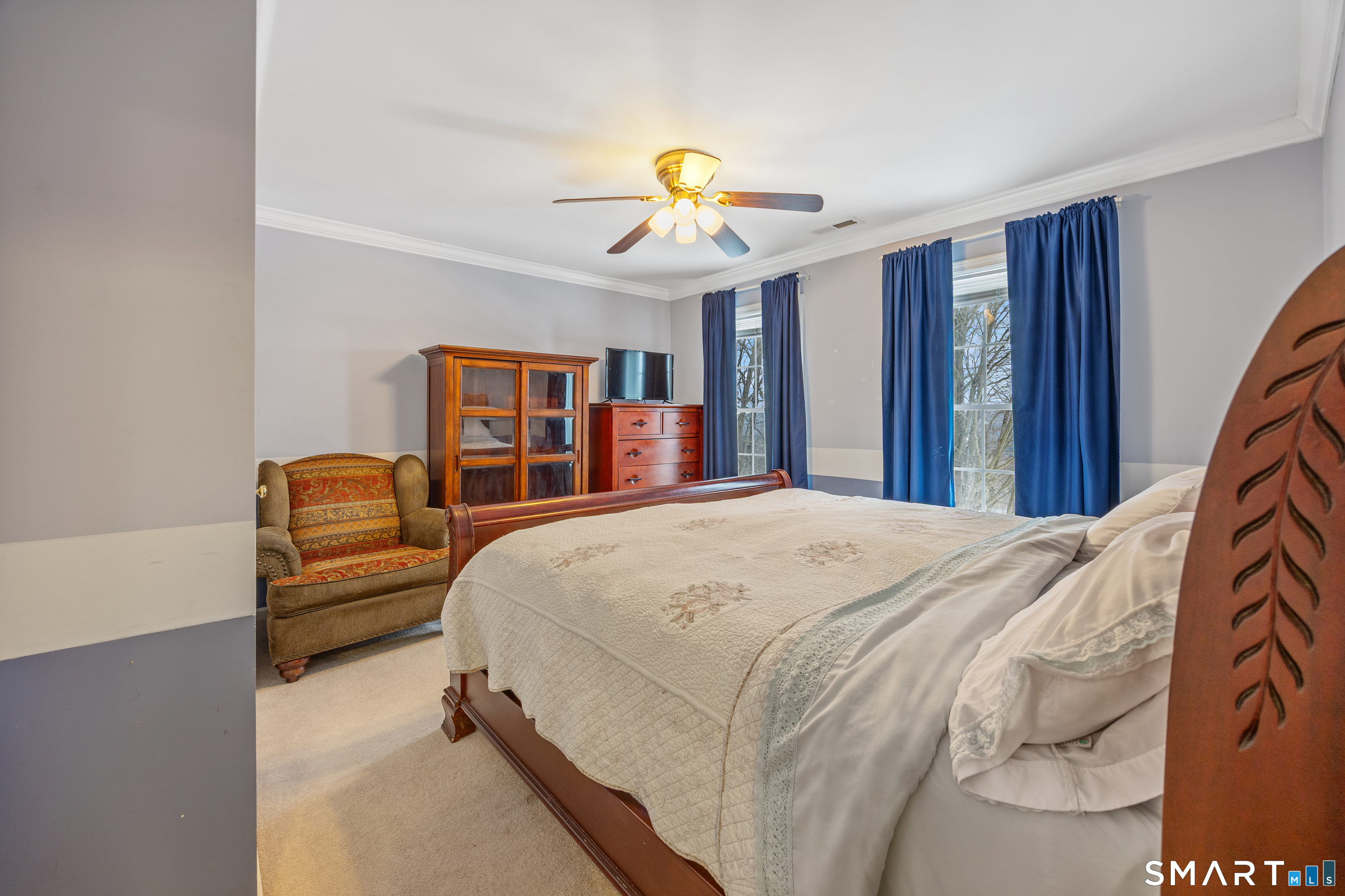 3 Ellen Lane Thomaston, CT 06787 - Photo 26 of 40 a bed room with a bed and a chandelier