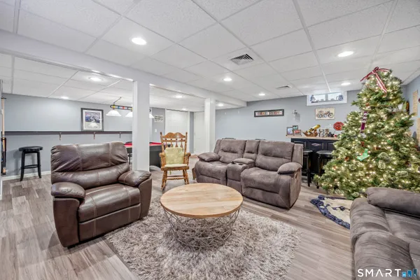 a room with furniture and pool table
