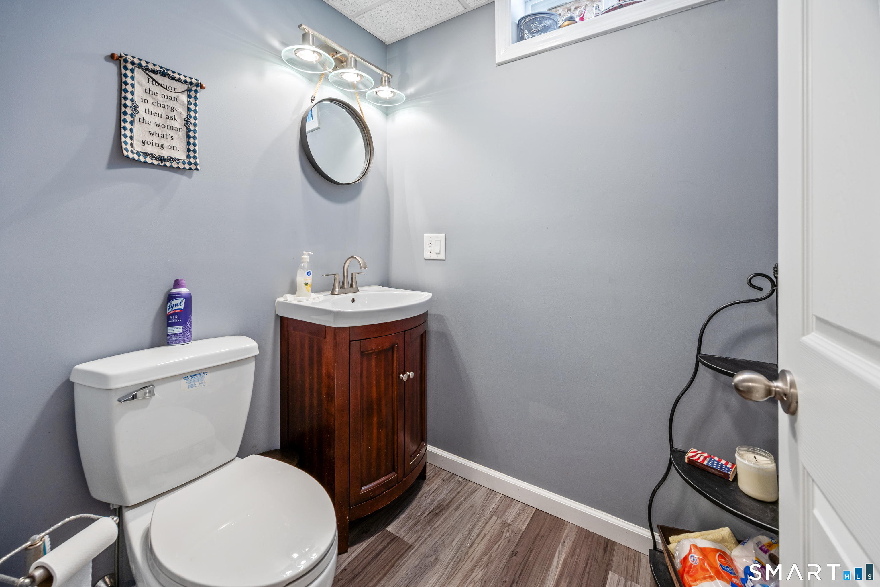 3 Ellen Lane Thomaston, CT 06787 - Photo 35 of 40 a bathroom with a toilet sink vanity and mirror