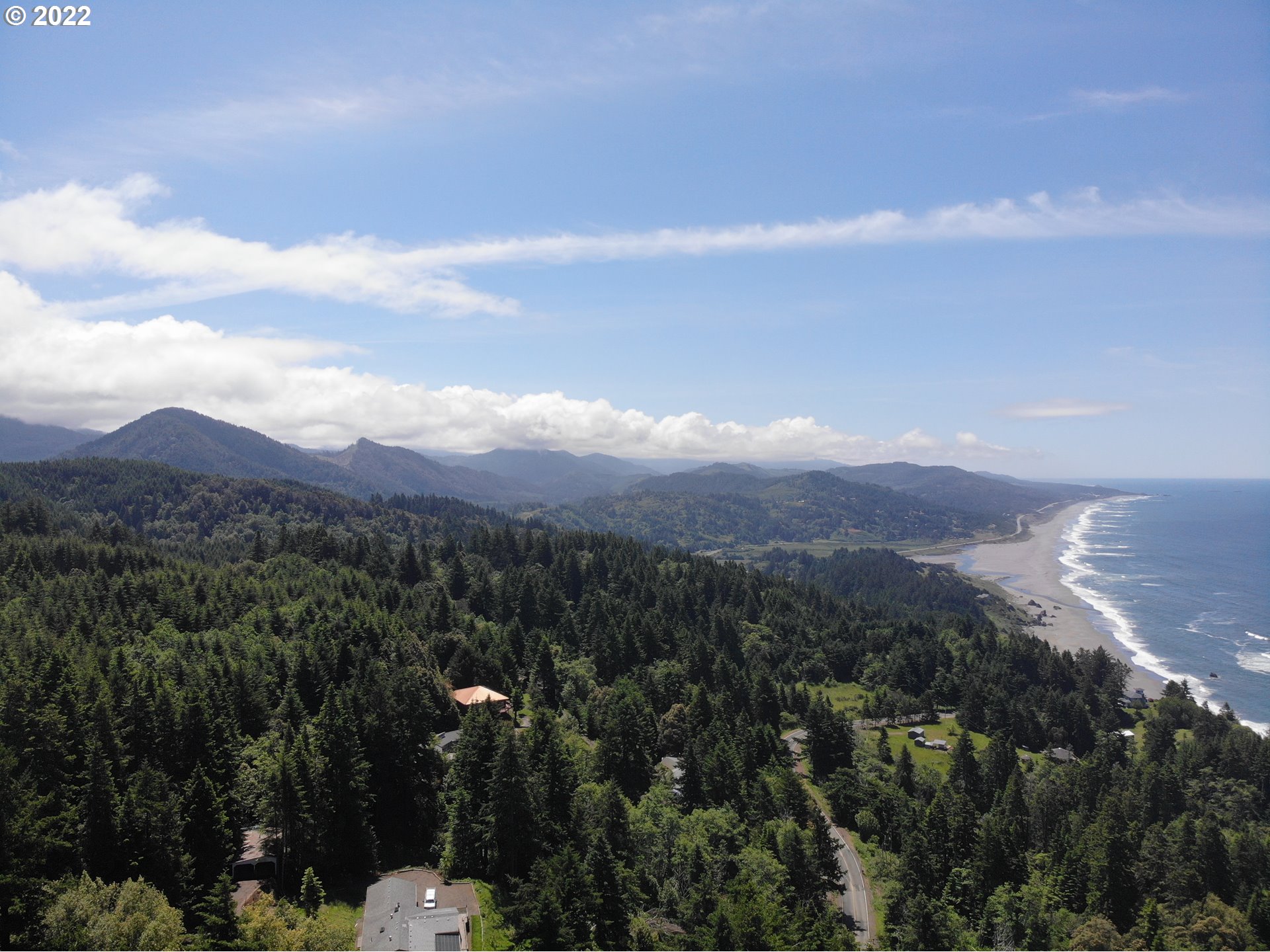 Skyview, Unit 101 Gold Beach, OR 97444 - Photo 10 of 16 a view of a city with lush green forest