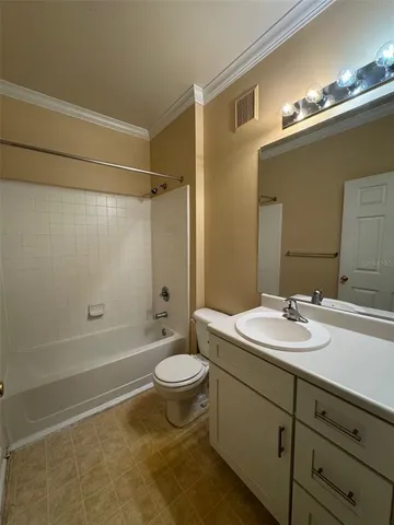 a bathroom with a sink toilet a mirror and shower