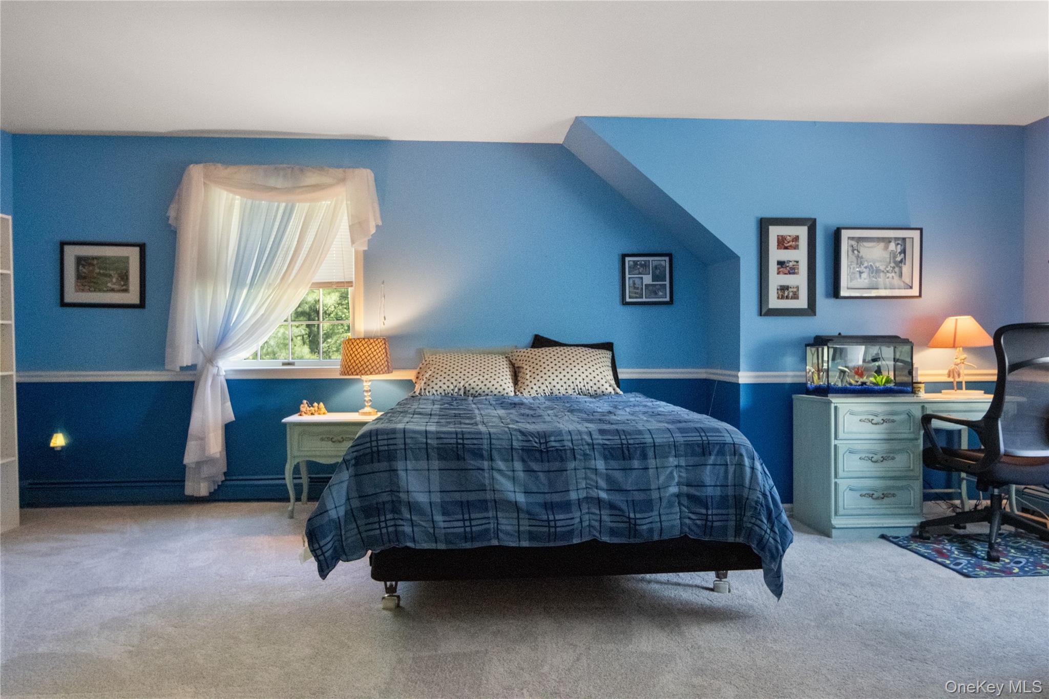214 West Mombasha Road Monroe, NY 10950 - Photo 32 of 43 a bedroom with a bed and a table in it