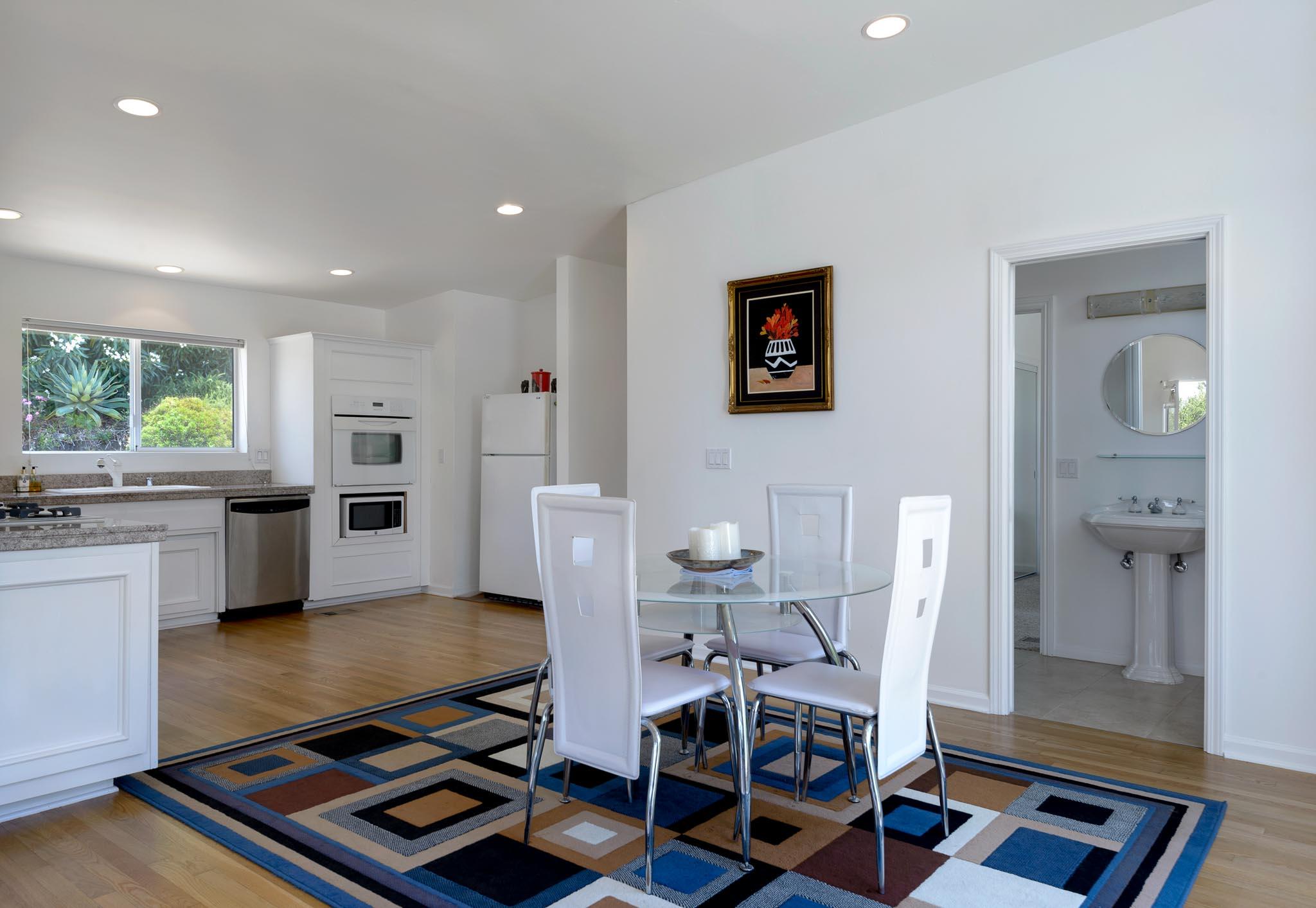 317 Conejo Road Santa Barbara, CA 93103 - Photo 5 of 15 a living room with furniture and a table