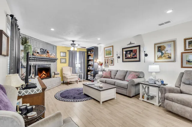 a kitchen with a sink stove and white cabinets