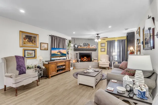 a view of a pathway with a wrought fence