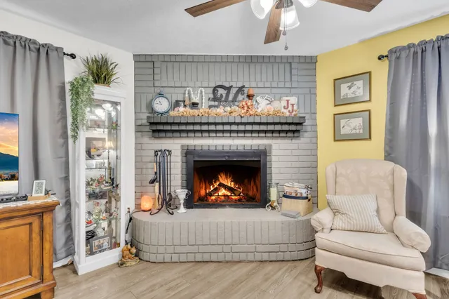 a view of a patio with table and chairs and potted plants